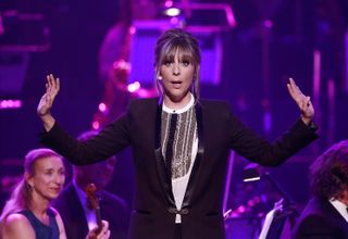 Mel Giedroyc on stage at The Royal Albert Hall.