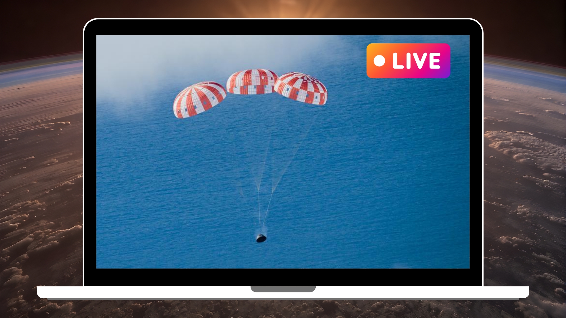 laptop graphic showing the landing of an orion space capsule with red and white striped parachutes, it is heading for the ocean, during artemis 1 mission. A similar scene will play out today April 10 with return of Artemis 2.