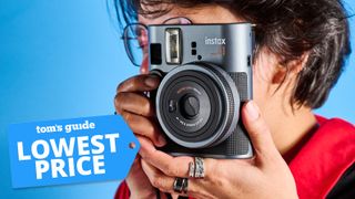 A person holding a Fujifilm Instax mini 41