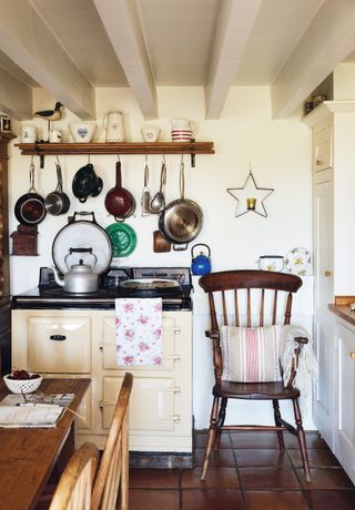 country cottage kitchen with utensils on display photographed by darren chung
