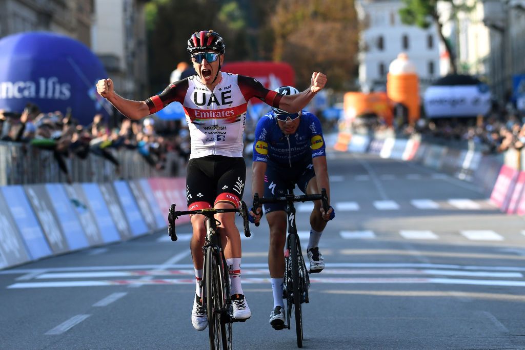 BERGAMO ITALY OCTOBER 09 Tadej Pogacar of Slovenia and UAE Team Emirates celebrates at finish line as race winner ahead of Fausto Masnada of Italy and Team Deceuninck QuickStep during the 115th Il Lombardia 2021 a 239km race from Como to Bergamo ilombardia UCIWT on October 09 2021 in Bergamo Italy Photo by Tim de WaeleGetty Images