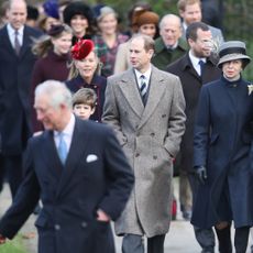 King Charles, Prince Edward, Princess Anne, Prince William, Prince Harry, Kate Middleton and other members of the Royal Family wearing coats walking to church on Christmas Day