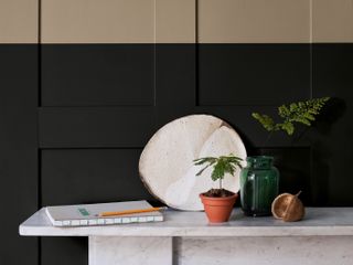 half painted wall panelling in beige and black