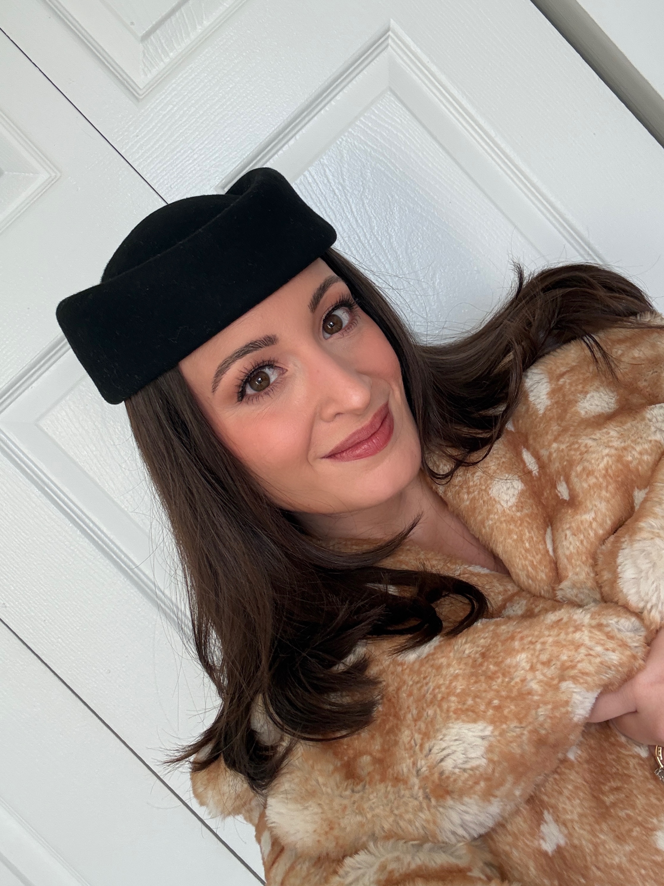 Bella Gerard wearing a cloche hat