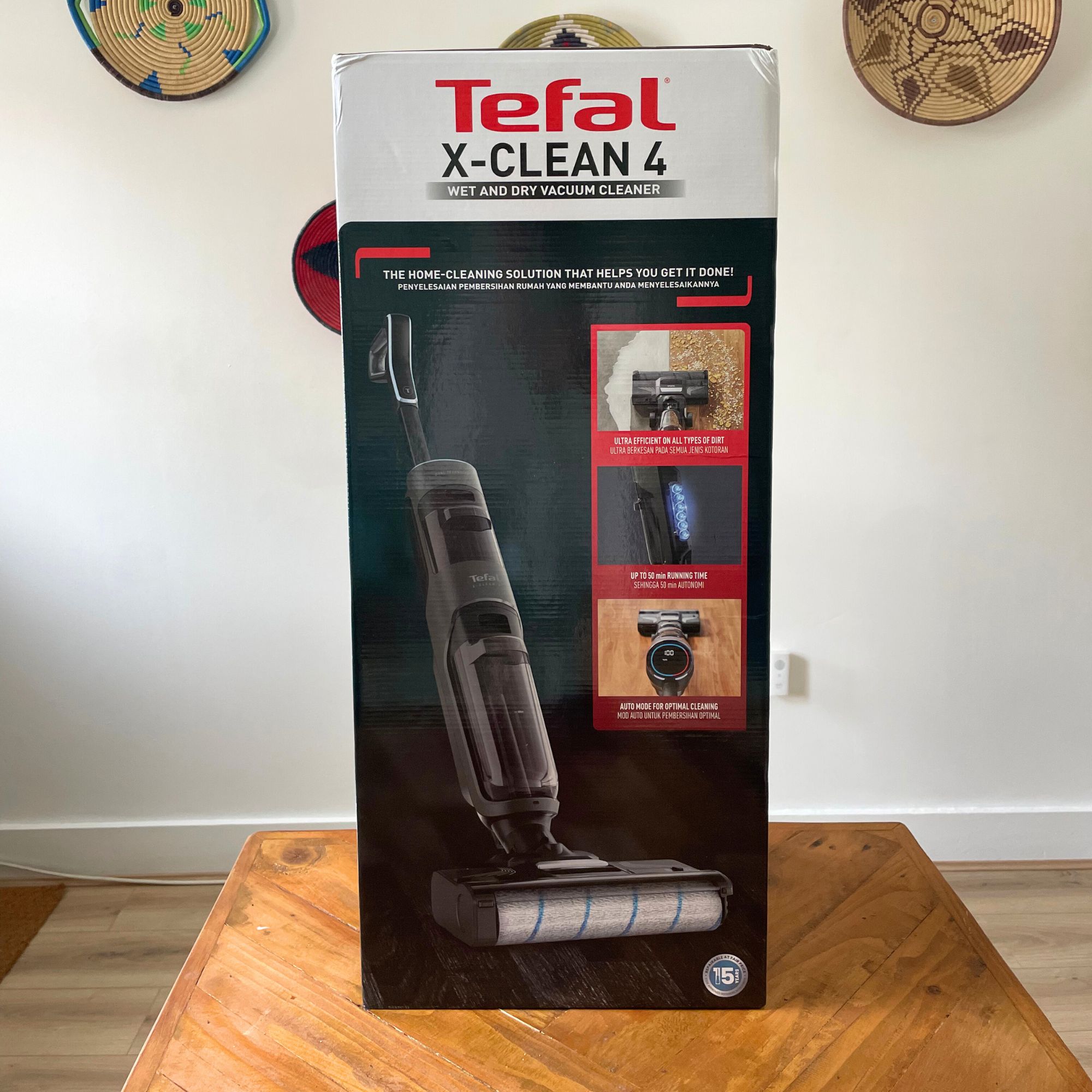 Tefal X-CLEAN 4 vacuum mop box sitting on a wooden table