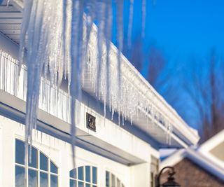 Icicles in gutters on a bright day