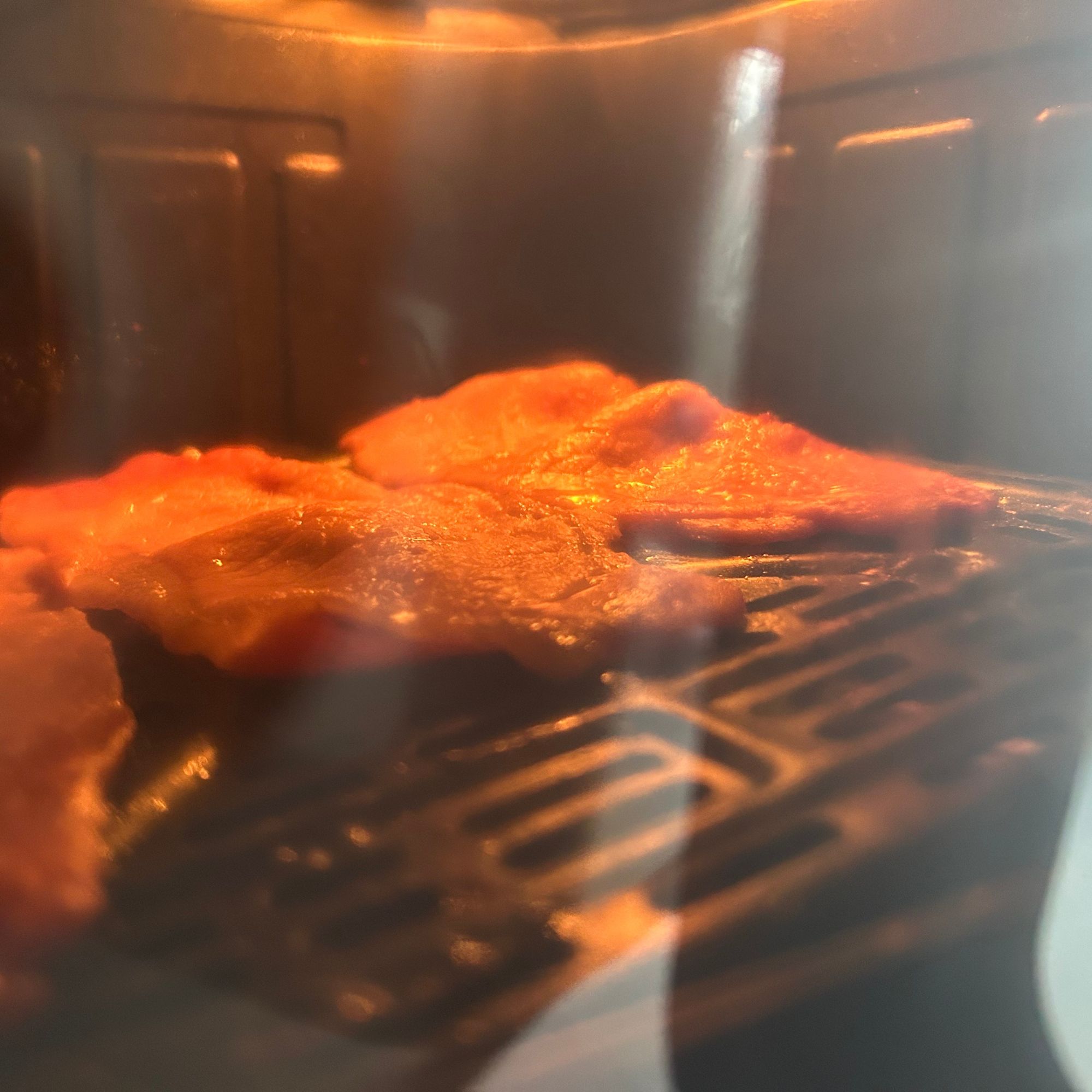 Instant Pot Vortex Compact 5L Air Fryer - view of bacon through window with light