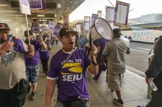 Workers stage a one-day walkout at Los Angeles International Airport. 