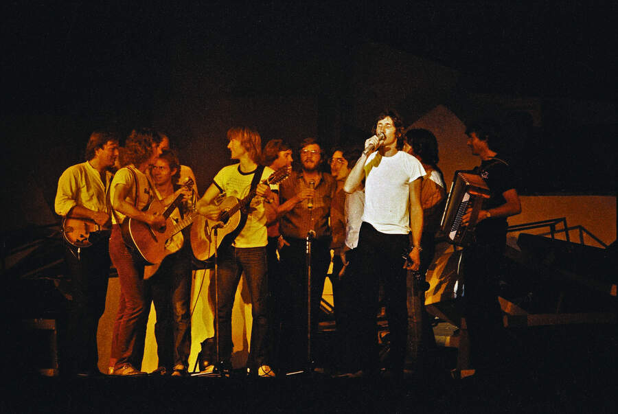 Pink Floyd perform on stage at Earls Court Arena on 'The Wall' tour, England. David Gilmour and Roger Waters are pictured here with other musicians performing the show's final song 'Outside The Wall'.
