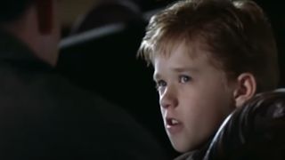 A close-up of Haley Joel Osment as Cole Sear talking during the movie, The Sixth Sense.