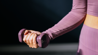 Woman holding a dumbbell