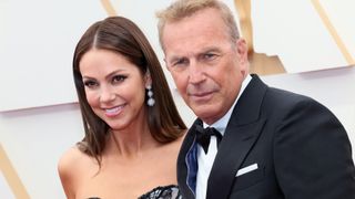 Christine Baumgartner and Kevin Costner attend the 94th Annual Academy Awards at Hollywood and Highland on March 27, 2022 in Hollywood, California.