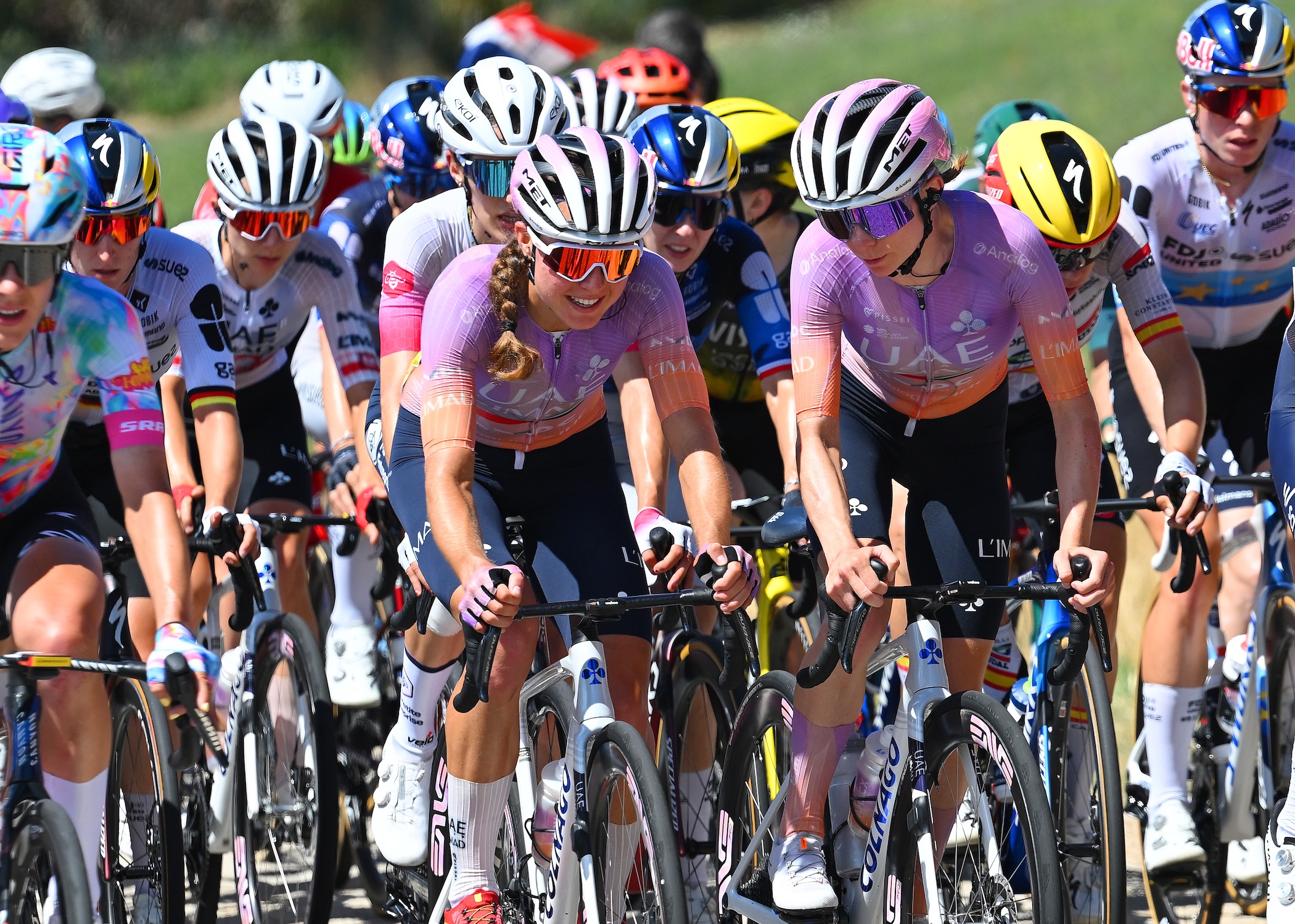 Paula Blasi (left) rides alongside UAE teammate Maeva Squiban on stage 6 at 2026 Tour de France Femmes