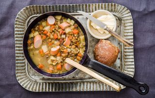 A saucepan of lentil and sausage soup how to cook lentils