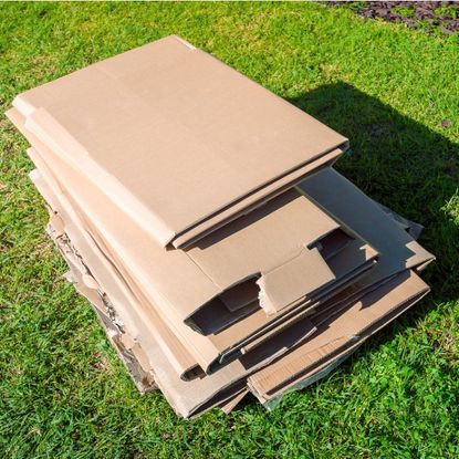 A stack of cardboard on a lawn