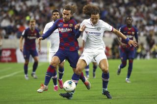 David Luiz, right, and Barcelona’s Antoine Griezmann, left, compete for the ball