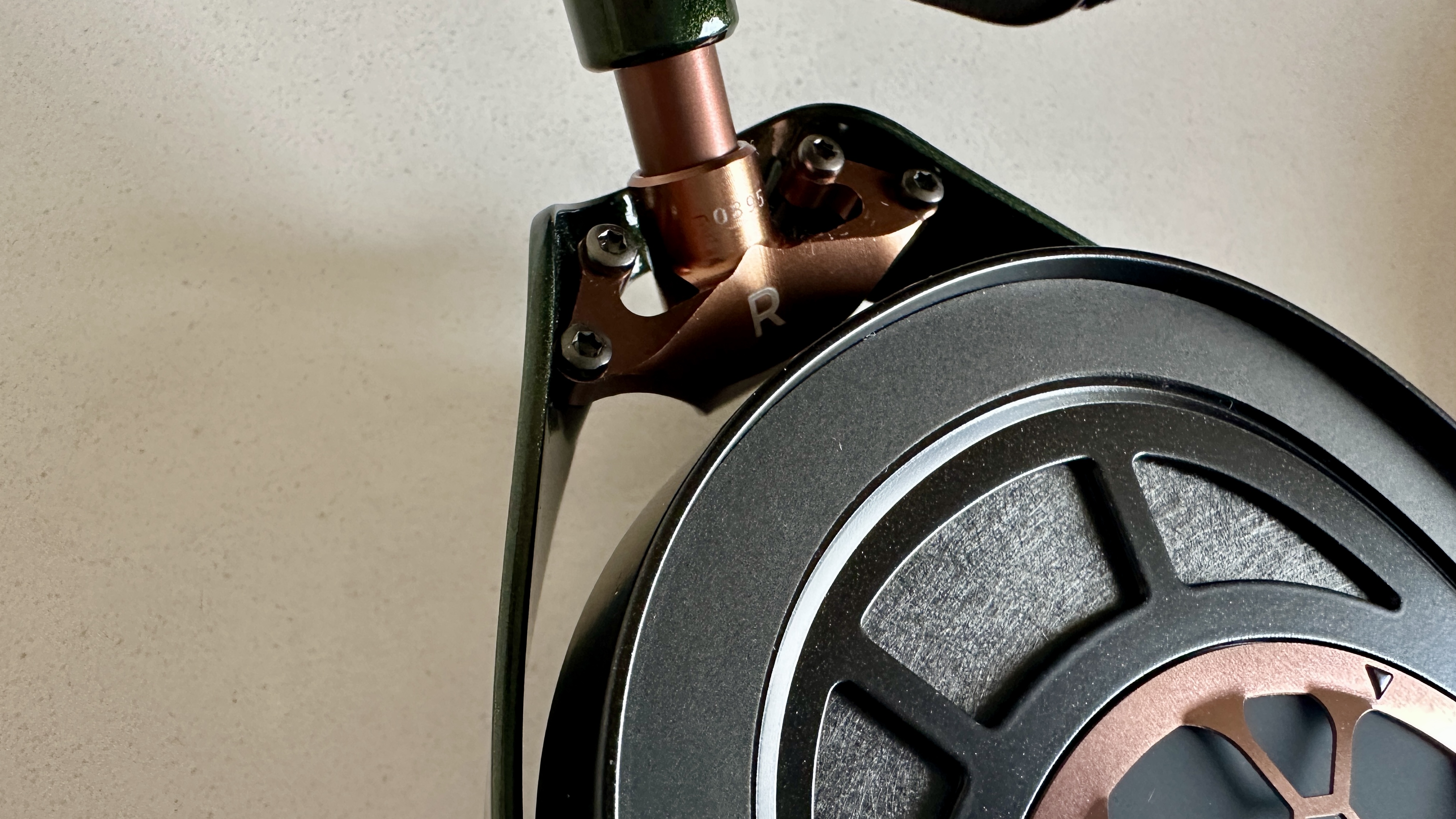 Meze Audio Strada headphones with wooden ear cups, in close-up and with their case and cables visible, on a white table