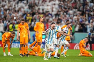 Lionel Messi and his Argentina team-mates celebrate victory on penalties against the Netherlands in the World Cup quarter-finals in Qatar in December 2010.