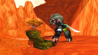 World of Warcraft Tauren character reaching into an open treasure chest
