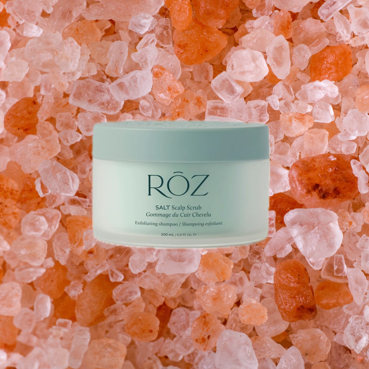 a jar of scalp scrub edited on top of himalayan salt crystals