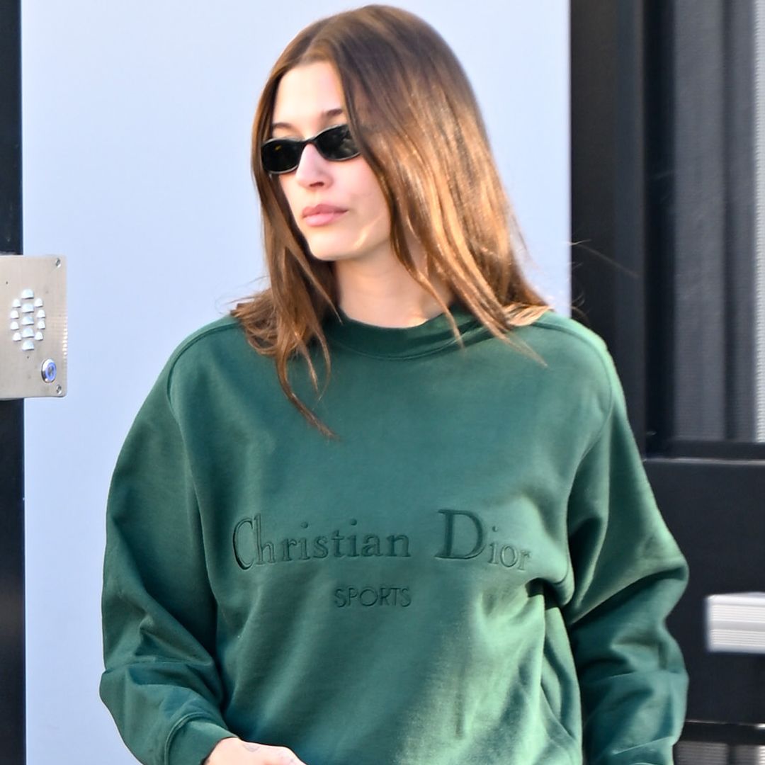 Hailey Bieber styled an oversize Dior sweatshirt with wide-leg jeans and a Dior bowling bag