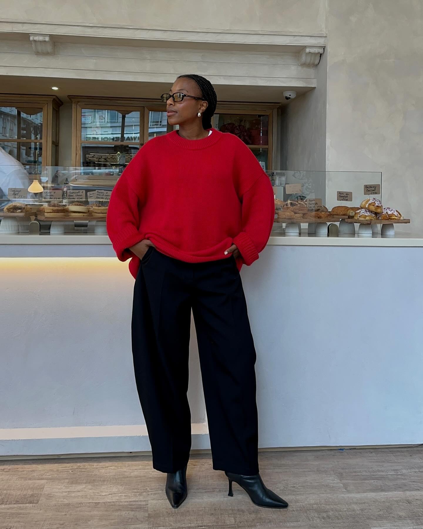 Taffy in red jumper and heeled boots
