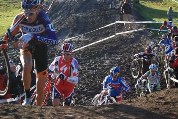 Trebon leads Wells, Johnson and Powers on the muddy run-up.