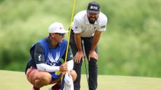 Mark Hubbard of the United States and his caddie Matt Picanso prepare to putt on the second green during the third round of the 2024 PGA Championship at Valhalla Golf Club on May 18, 2024 in Louisville, Kentucky.