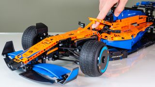 Turning the Lego Technic McLaren Formula 1 Race Car's steering wheel to turn the front wheels