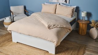 A mattress we tested is dressed with neutral colour bed linens and pillows