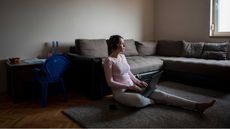 photo of woman sitting at home on floor