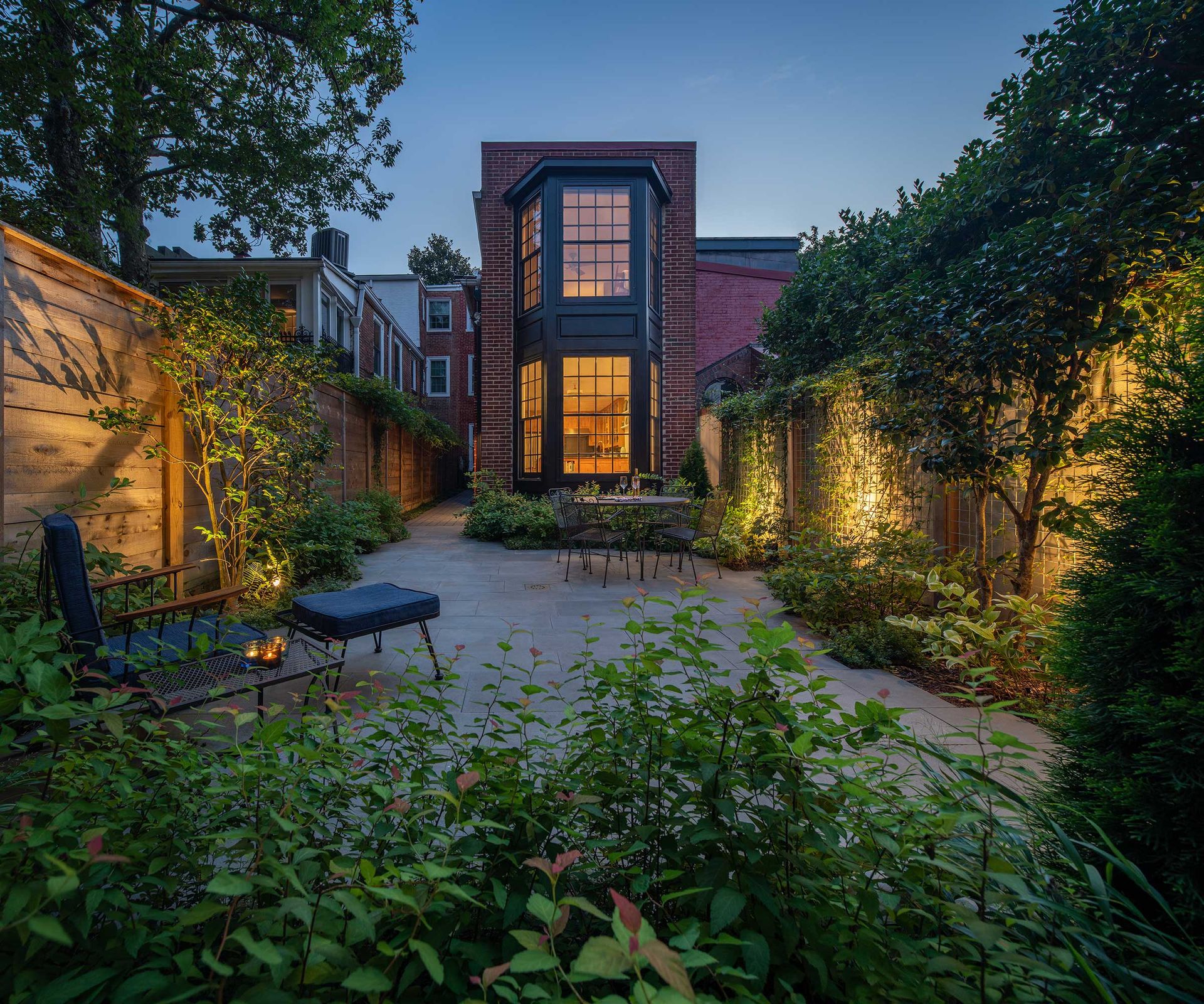 modern townhouse backyard with lighting