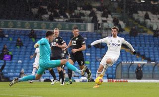 Burnley keeper Nick Pope concedes a penalty for a challenge on Leeds striker Patrick Bamford