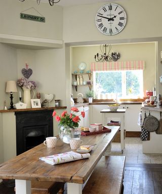 country kitchen dining area with armless and backless wooden benches