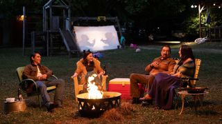 Four supporting characters in Marvel's Echo TV show share a joke around a campfire