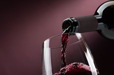 Red wine being poured into glass