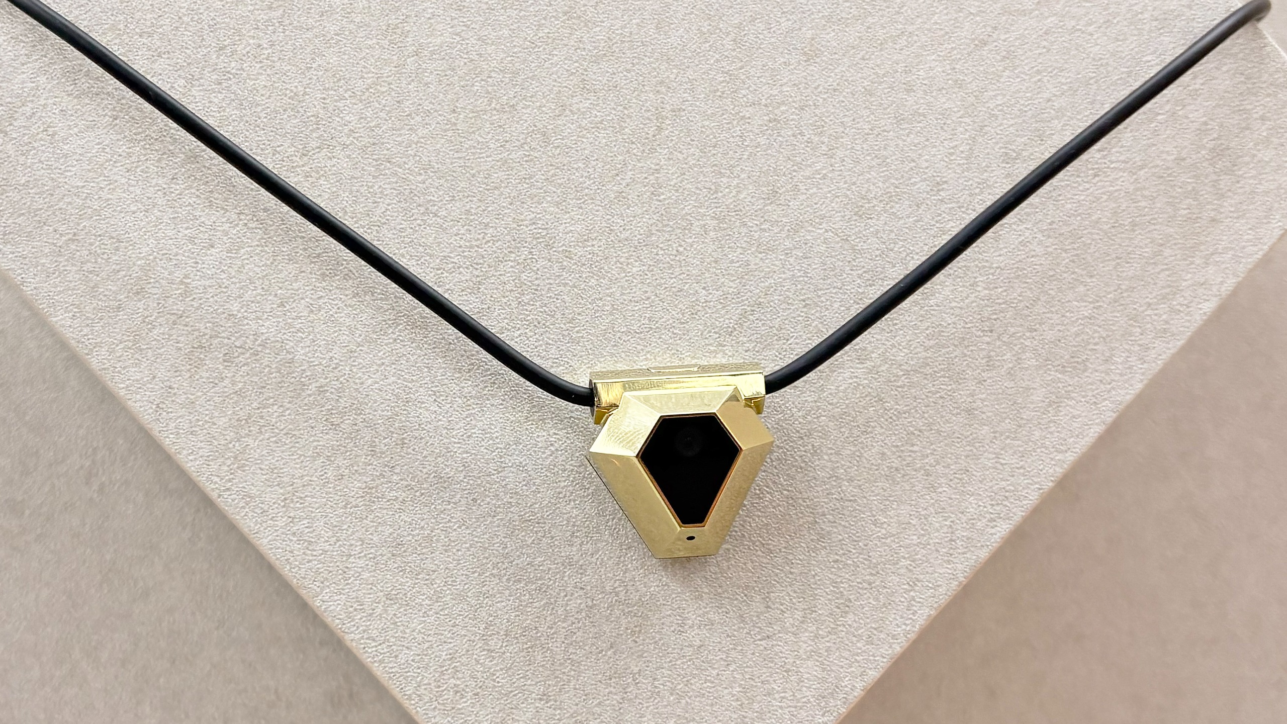 Close-up of the Odyss N1 AI-powered necklace that tracks what you eat