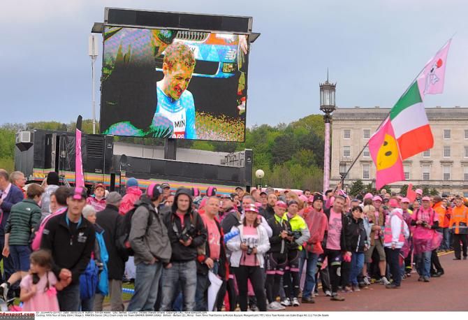 The crowds watch the big screen to find out what's up with the injured Dan Martin