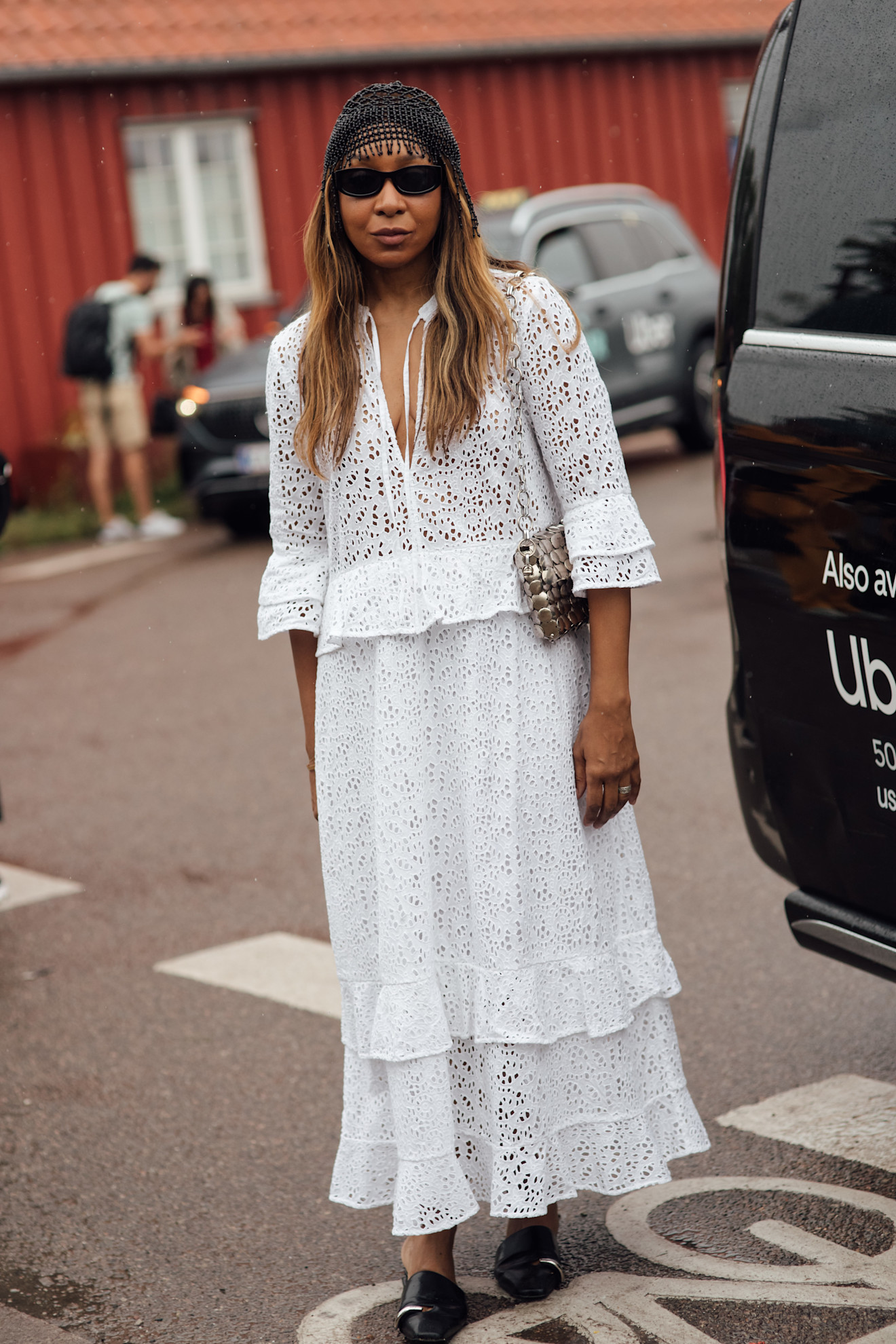 Woman wearing white dress during Copenhagen Fashion Week spring/summer 2027.