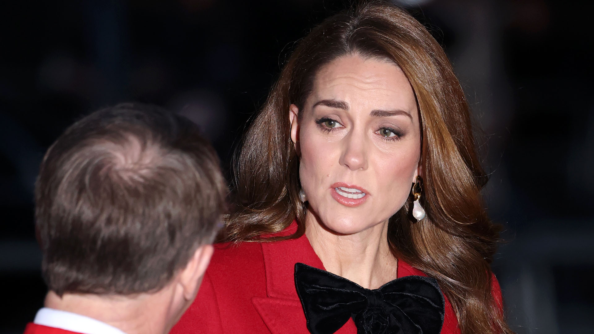 Kate Middleton in a red ensemble at the fourth annual "Together at Christmas" carol service at Westminster Abbey.