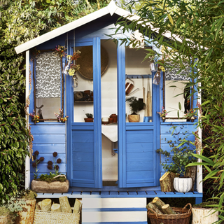 garden shed with blue rotten wood