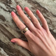 A photo of a hand painted with Essie Glass Nail Polish