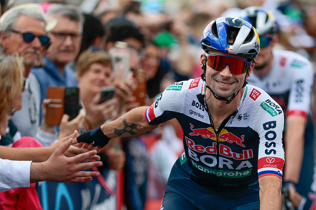Red Bull-Bora-Hansgrohe's Slovenian rider Primoz Roglic greets the fans prior to the start of the 14th stage of the 108th Giro d'Italia cycling race of 195kms from Treviso in Italy to Nova Gorica in Slovenia on May 24, 2025. (Photo by Luca Bettini / AFP)
