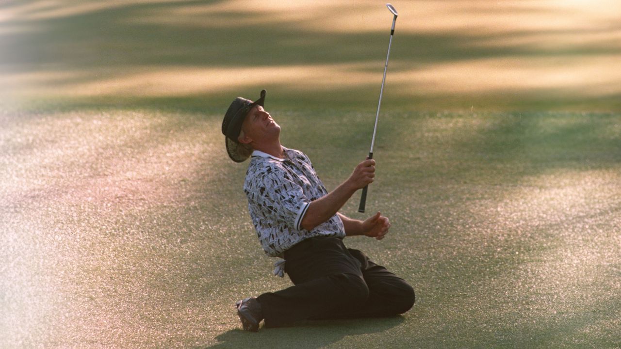 Photo of greg norman collapsign to his knees