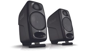 A pair of IK Multimedia iLoud Micro studio monitors on a white background
