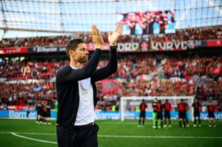 Xabi Alonso applauds the Bayer Leverkusen fans after victory over Heidenheim in September 2023.