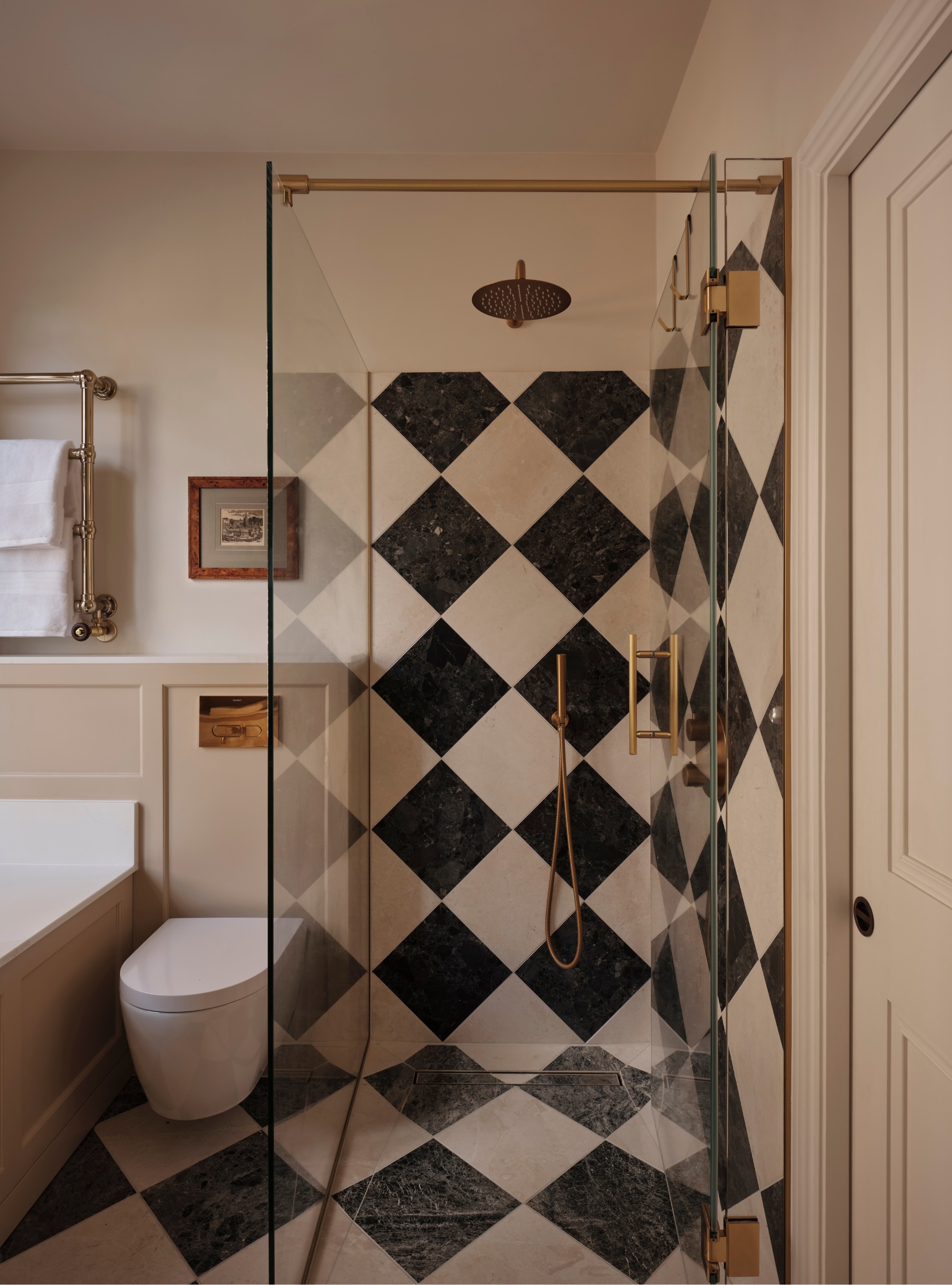 Bathroom with checkerboard floor tiles and checkerboard shower wall tiles