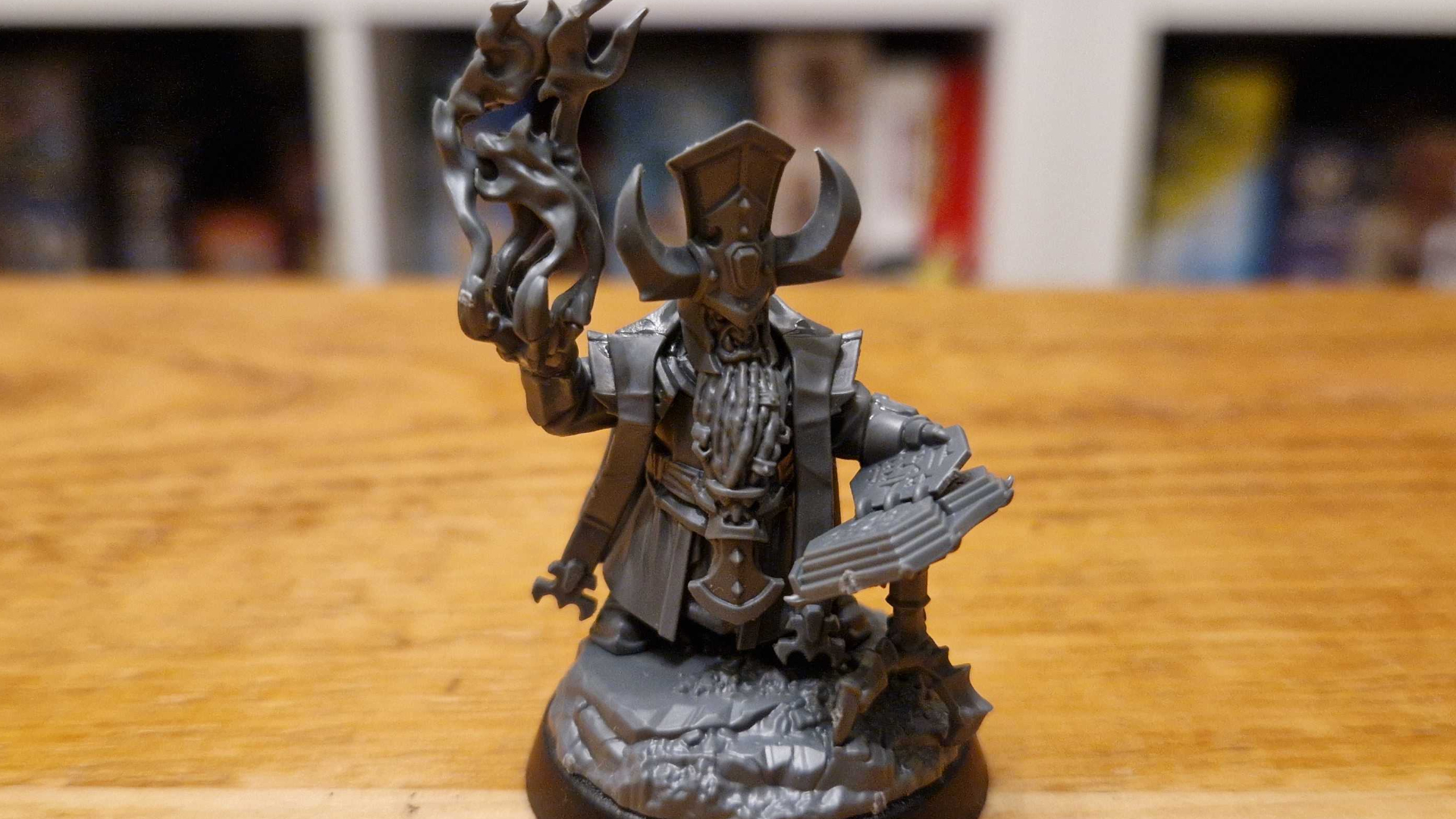 Helsmiths of Hashut Daemonsmith model on a wooden surface