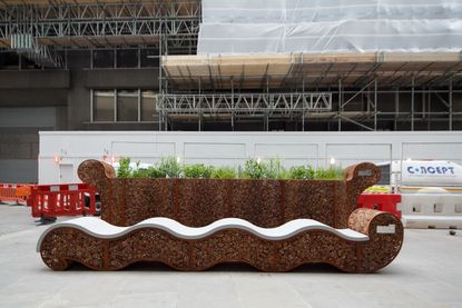 Large bench with plants coming out the top