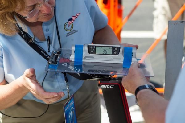 Officials check to make sure a saddle is within UCI restrictions.